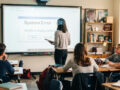Teacher stands at interactive display that shows error message and students are disengaged